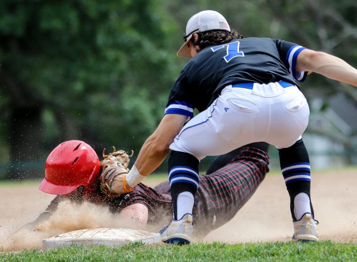 Milton's Ryan Dexter is tagged during a game in the Division 2 state tournament against Leominster at Cunningham Park on Saturday, June 11, 2022.
