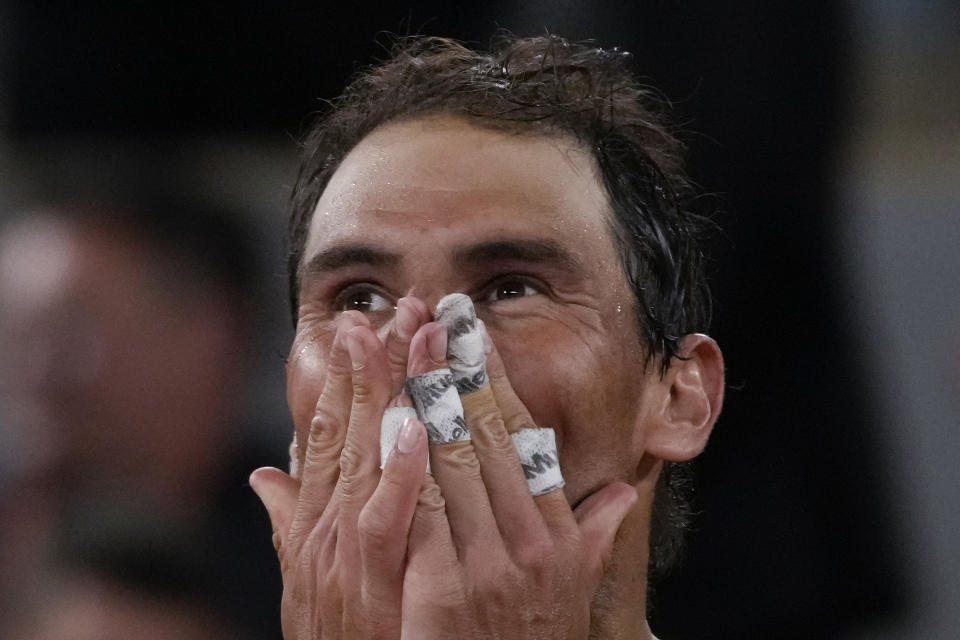 Spain's Rafael Nadal celebrates winning his quarterfinal match against Serbia's Novak Djokovic in four sets, 6-2, 4-6, 6-2, 7-6 (7-4), at the French Open tennis tournament in Roland Garros stadium in Paris, France, Wednesday, June 1, 2022. (AP Photo/Christophe Ena)