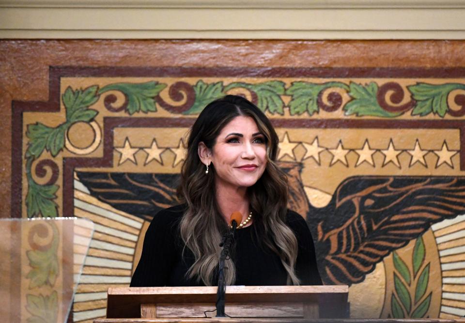 Governor Kristi Noem smiles during a break for applause as she gives the annual budget address on Tuesday, December 6, 2022, at the South Dakota State Capitol in Pierre.