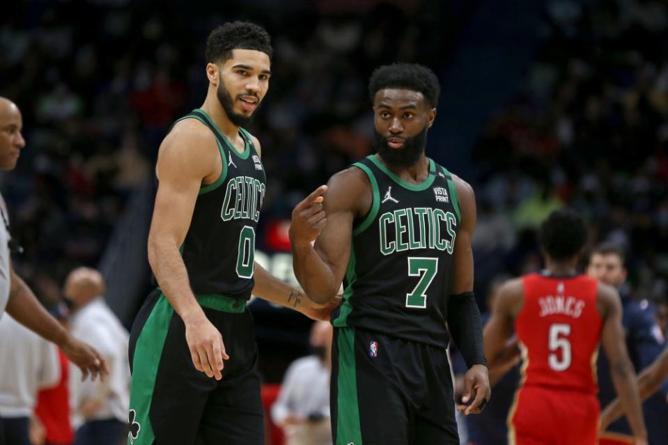 Jaylen Brown talking with Jayson Tatum