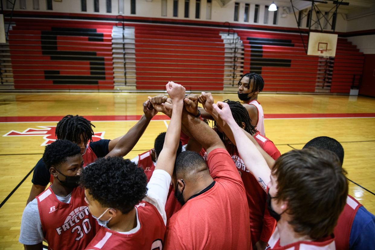 The Seventy-First boys' basketball huddle together at the start of practice on Tuesday, Nov. 16, 2021, at Seventy-First High School.