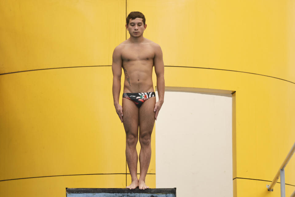 Kevin Berlin, a 10-meter Olympic diver, trains in Monterrey, Mexico, Tuesday, June 13, 2023. Struggling for economic resources, Berlin, with help from his relatives, created a coffee brand called “Olimpiada Café,” or Olympic Coffee. “At first we thought we would only sell it to family and friends, but then it started to go viral, and it reached more people,” said Berlin. (AP Photo/Jorge Mendoza)