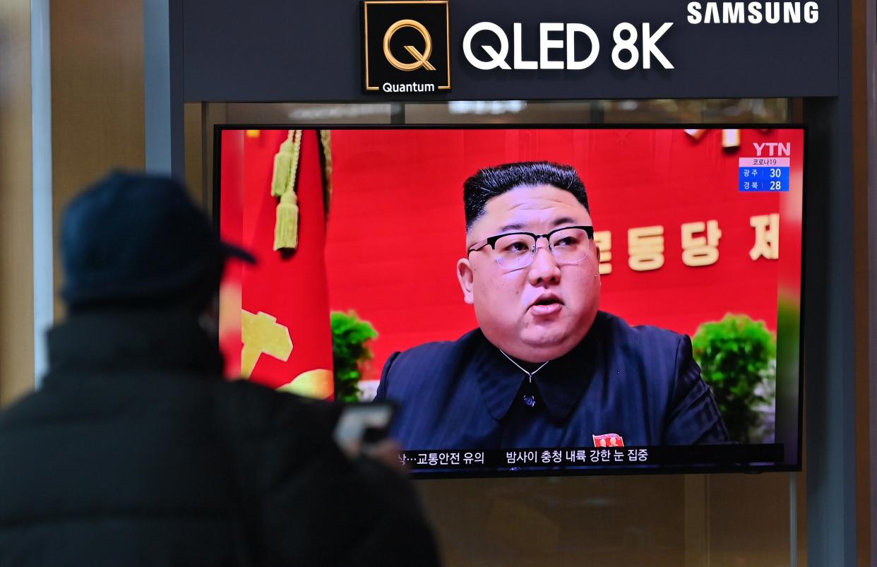 <p>A man watches a television screen showing news footage of North Korean leader Kim Jong Un attending the 8th congress of the ruling Workers' Party held in Pyongyang, at a railway station in Seoul on 6 January 2021</p> (AFP via Getty Images)