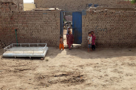 Children stand outside their home in Mianwali Qureshian, a village in southern Punjab, Pakistan June 27, 2018. Picture taken June 27, 2018. REUTERS/Drazen Jorgic