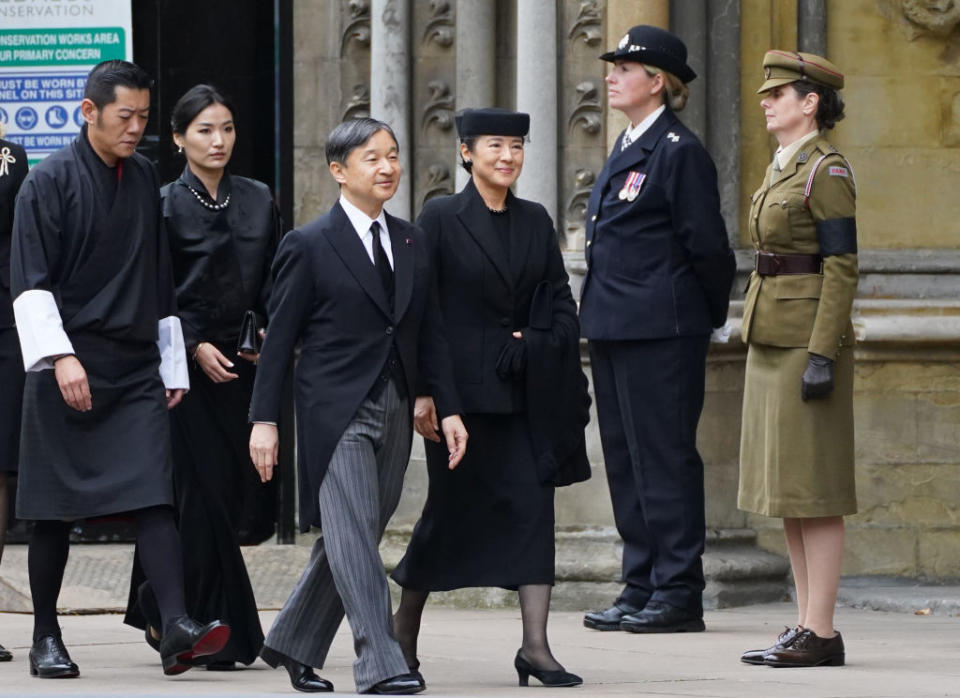Japan's Emperor Naruhito (centre) and wife Empress Masako arrive for the state funeral and burial of Queen Elizabeth II at Westminster Abbey on September 19, 2022 in London, England.<span class="copyright">James Manning/WPA Pool—Getty Images</span>
