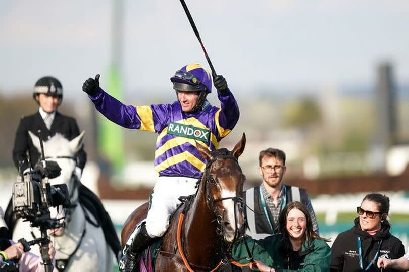 Derek Fox celebrates on Corach Rambler after winning the Grand National