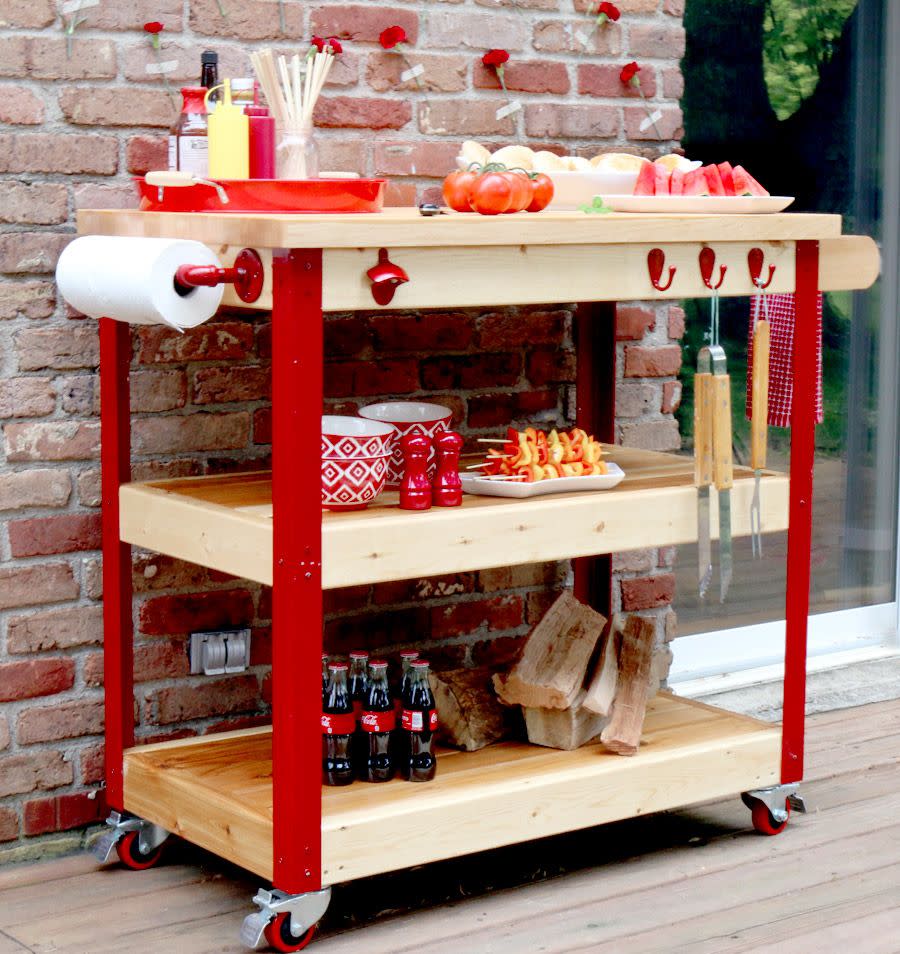 <p>Complete with rolling wheels, a paper towel holder for easy clean-up, and a butcher's block, your favorite grill master is bound to love this summer-ready gift.</p><p><strong>Get the tutorial at <a href="https://jenwoodhouse.com/rolling-grill-cart/" rel="nofollow noopener" target="_blank" data-ylk="slk:The House of Wood" class="link ">The House of Wood</a>.</strong></p>