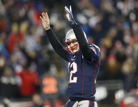 Jan 14, 2017; Foxborough, MA, USA; New England Patriots quarterback Tom Brady (12) celebrates a touchdown against the Houston Texans during the fourth quarter in the AFC Divisional playoff game at Gillette Stadium. Mandatory Credit: Greg M. Cooper-USA TODAY Sports