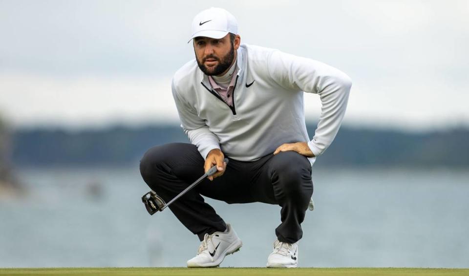 Scottie Scheffler prepares to putt on the 18th green after a rain delay pushed the final round of the RBC Heritage Presented by Boeing at Harbour Town Golf Links to Monday, April 22, 2024 in Sea Pines on Hilton Head Island.