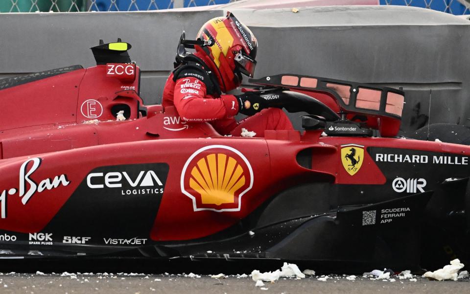 Ferrari's Spanish driver Carlos Sainz Jr exits the car after his crash during the second practice session for the Abu Dhabi Formula One Grand Prix at the Yas Marina Circuit in the Emirati city on November 24, 2023