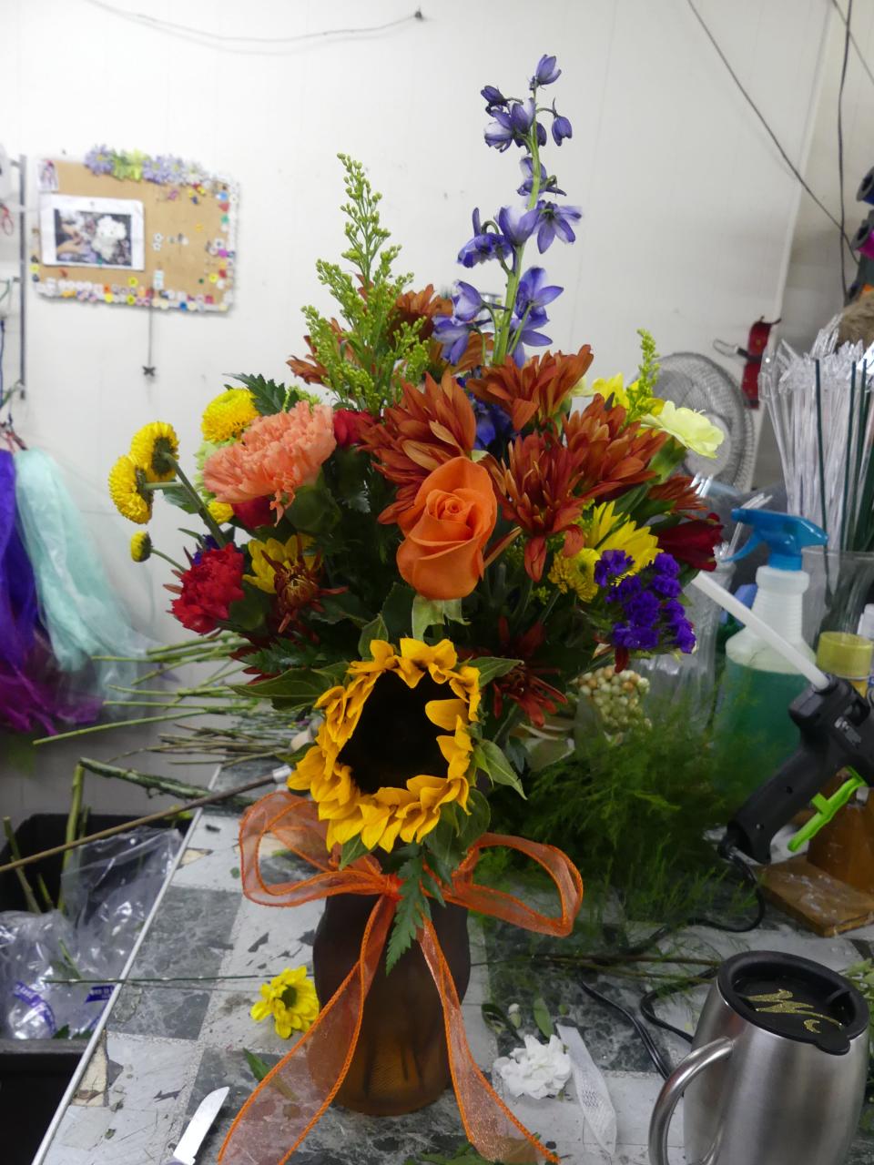 Mary Rusk creates a fall flower arrangement from scratch.