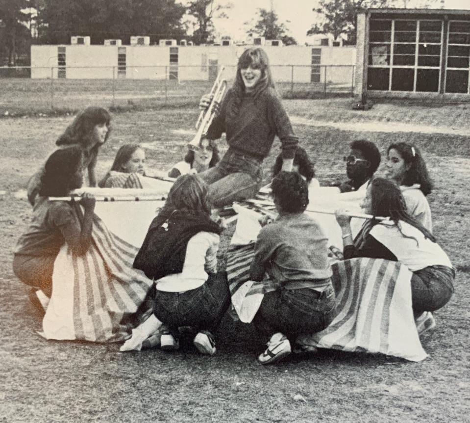 As a senior in high school, Suzy Fleming Leonard, center, was more concerned with trumpet solos than reunions.