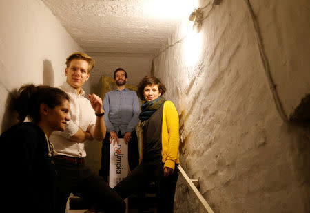 Edina Pottyondy, Miklos Hajnal, Andras Fekete-Gyor and Anna Orosz, leading members of political movement Momentum which challenges Budapest's 2024 Olympic bid with a referendum, stand on the steps leading to Momentum's headquarters, located in a basement in Budapest, Hungary, February 20, 2017. REUTERS/Laszlo Balogh