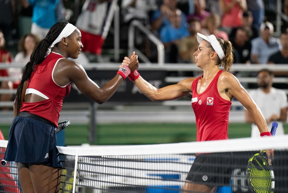 Apr 14, 2023; Delray Beach, FL, USA; Coco Gauff (USA) at the net with Julia Grabher (AUT) after their match at Delray Beach Tennis Center. Mandatory Credit: Susan Mullane-USA TODAY Sports
