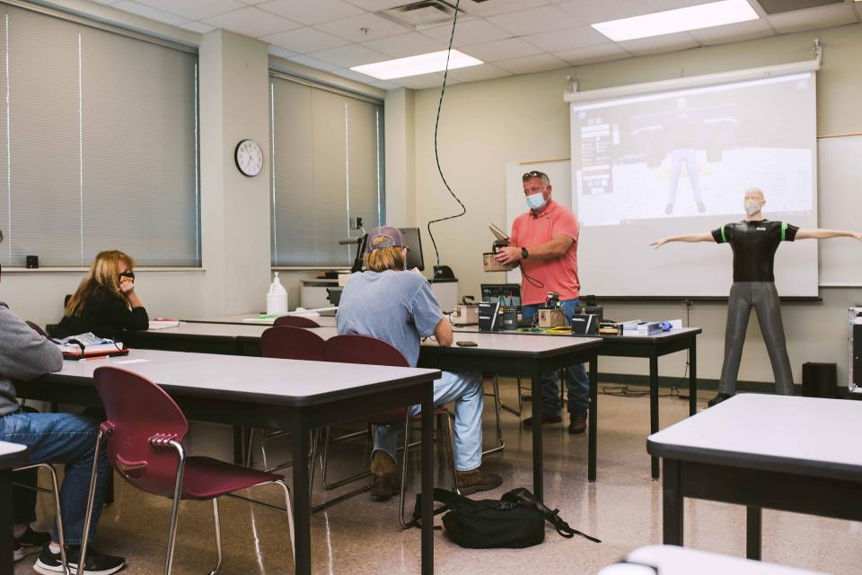 Instructor Chris Jones leads a class at Roane State Community College regarding radiation testing equipment.