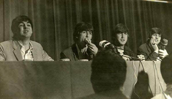 The Beatles are shown giving a news conference at the George Washington Hotel in this 1964 photo.