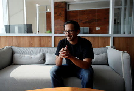 Nadiem Makarim, founder of the Indonesian ride-hailing and online payment firm Go-Jek speaks with Reuters during an interview at the Go-Jek offices in Jakarta, Indonesia, August 15, 2018. REUTERS/Darren Whiteside