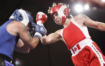 Conservative Sen. Patrick Brazeau and Justin Trudeau, then Liberal leader, fight in a charity boxing match in March 2012 in Ottawa. Trudeau stopped Brazeau in the third round. THE CANADIAN PRESS/Fred Chartrand