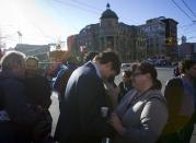 Leader of the Liberal Party of Canada MP Justin Trudeau talks to people in the downtown eastside neighbourhood in Vancouver, British Columbia December 18, 2013. REUTERS/Ben Nelms (CANADA - Tags: POLITICS)