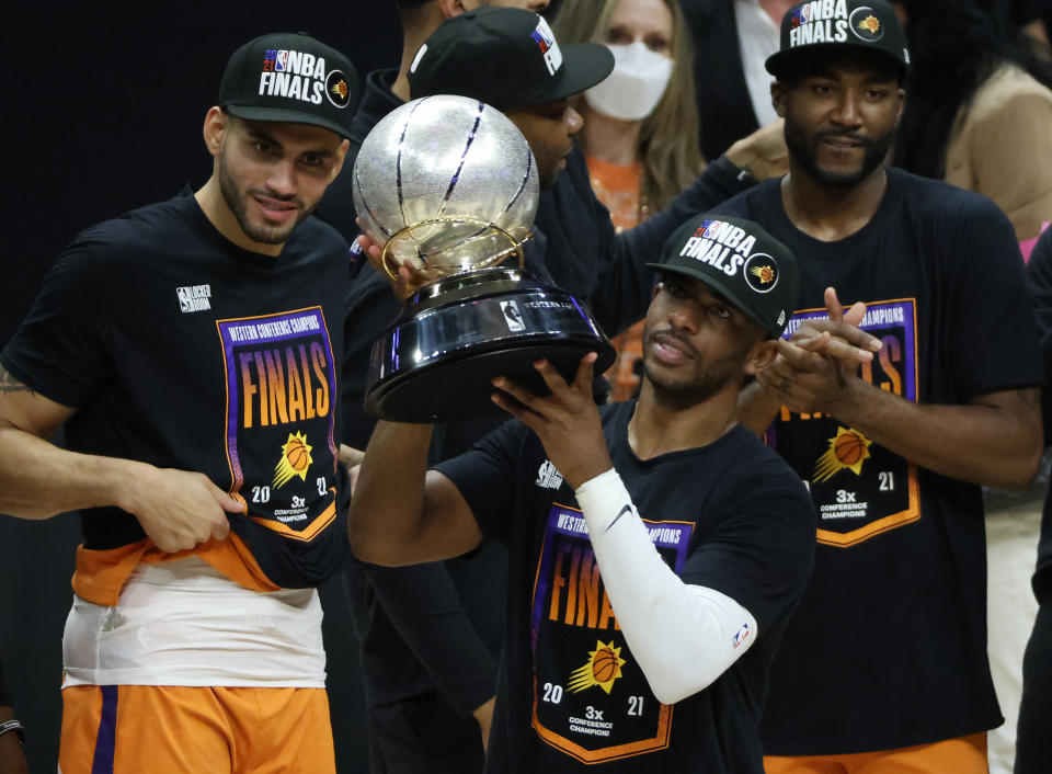 Chris Paul holds the Western Conference championship trophy after the Phoenix Suns defeated the Los Angeles Clippers in Game 6 of the Western Conference finals on June 30, 2021 in Los Angeles. (Harry How/Getty Images)