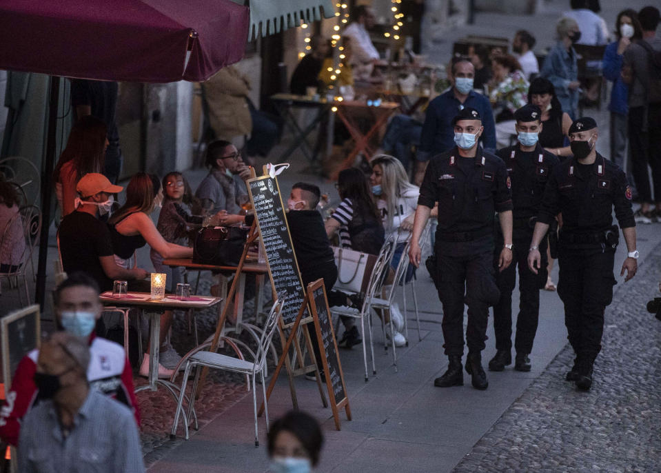 Carabinieri officers patrol the city trendy Navigli district in Milan, Italy, Tuesday, May 26, 2020. Two northern regions account for far more than half of Italy’s latest confirmed cases. According to Health Ministry figures, Lombardy, which was hardest hit by coronavirus infections and deaths in the nation’s outbreak, registered 159 new cases in the 24-hour period ending Tuesday evening, while neighboring Piedmont registered 86 cases. (AP Photo/Luca Bruno)