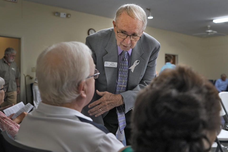 The Rev. Bill Farmer speaks to members of the congregation before a service at the Grace Methodist Church Sunday, May 14, 2023, in Homosassa Springs, Fla. Grace Methodist has been renting a former lodge hall for its services and has already started Bible studies and social outreaches as they work to attract attendees from their neighborhood. (AP Photo/Chris O'Meara)