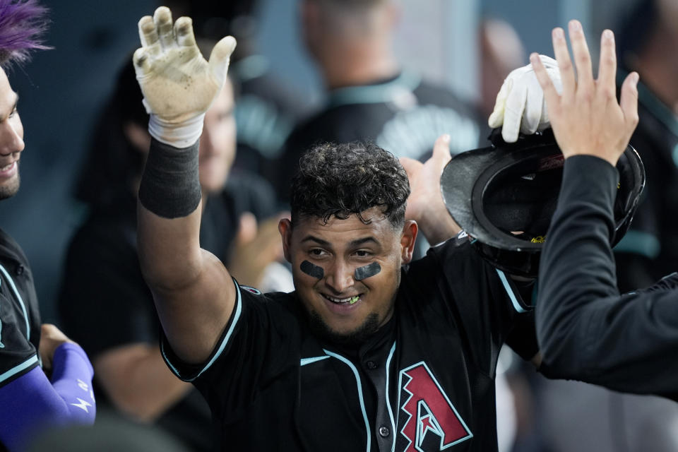 Arizona Diamondbacks' Gabriel Moreno celebrates scoring off a bunt single by Jake McCarthy during the eighth inning of a baseball game against the Los Angeles Dodgers, Tuesday, July 2, 2024, in Los Angeles. (AP Photo/Ryan Sun)