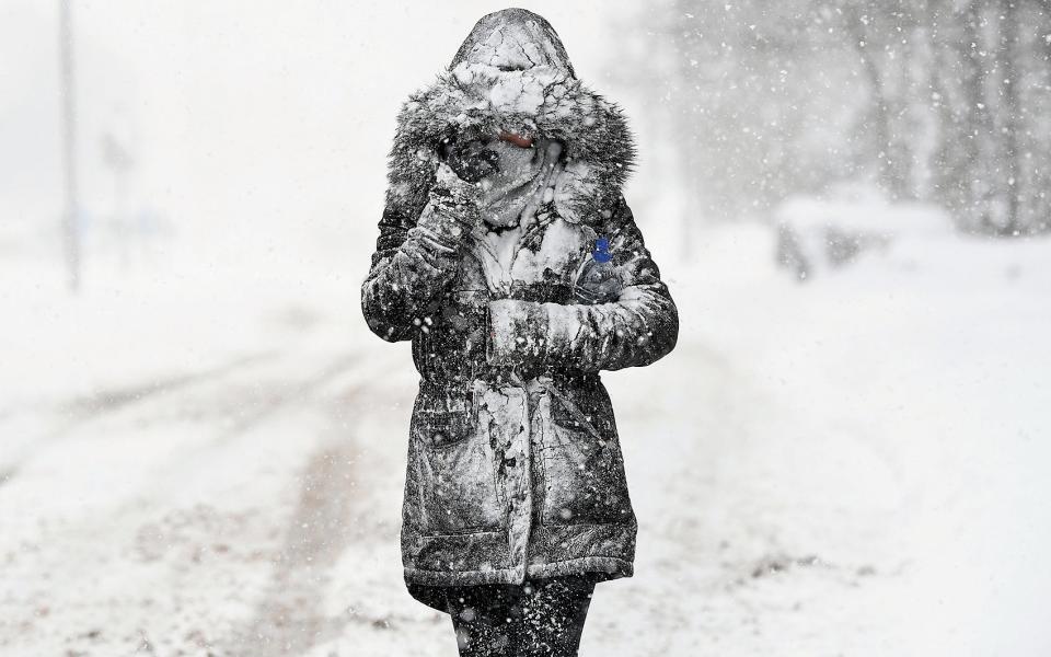 A woman makes her way through the snow as the 2018 'Beast from the East' strikes in Scotland