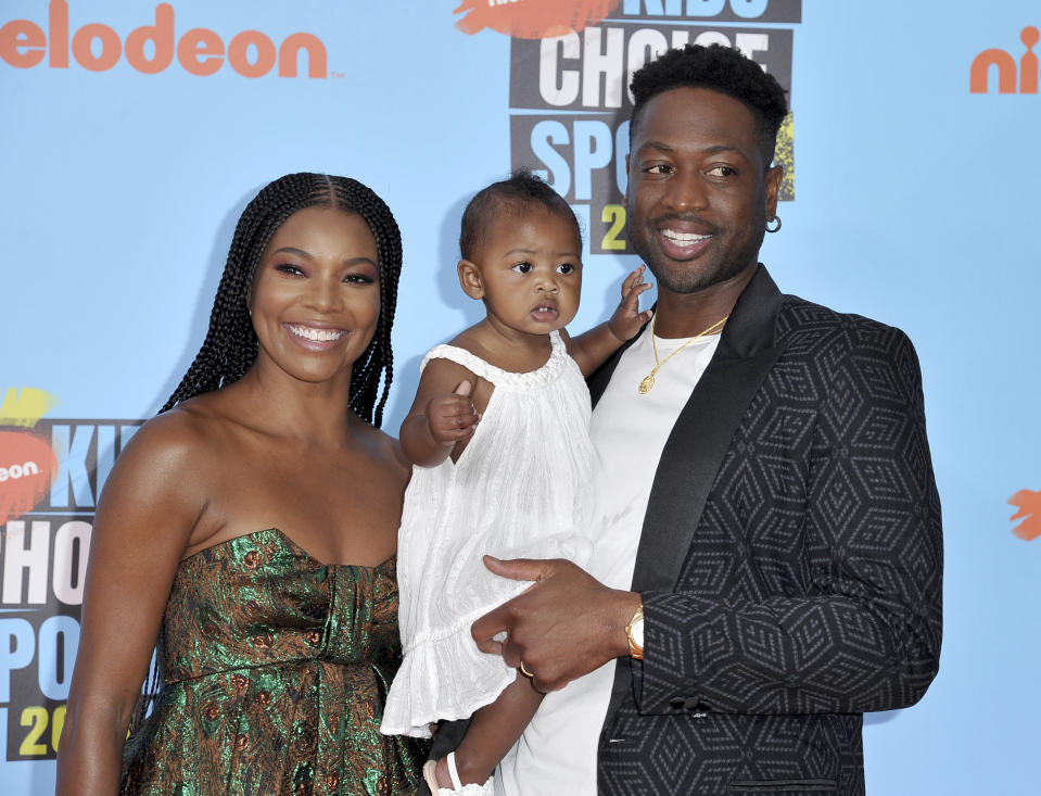 Gabrielle Union, Dwyane Wade and their daughter Kaavia James Union Wade at the Kids’ Choice Sports Awards in 2019. - Credit: Richard Shotwell/Invision/AP