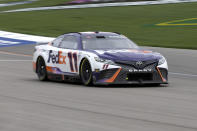 Denny Hamlin (11) rounds the track in Stage 1 during a NASCAR Cup Series auto race on Sunday, March 5, 2023, in Las Vegas. (AP Photo/Ellen Schmidt)
