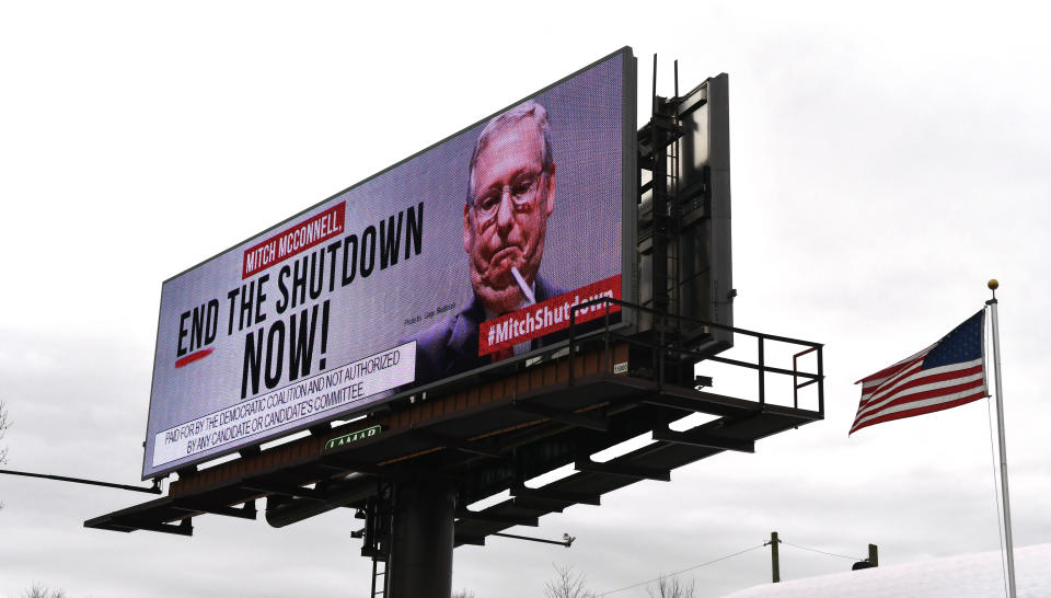 An electronic billboard, sponsored by the Democratic Coalition, shown Saturday, Jan. 12, 2019 in Nicholasville, Ky. McConnell, who is up for re-election in 2020 in a state where Trump tends to be more popular than he is, sees no other choice than to stand back and let the president who took the country into the shutdown decide how he wants to get out of it. (AP Photo/Timothy D. Easley)