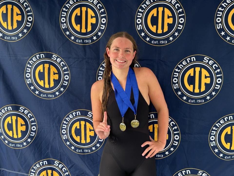Xavier Prep swimmer Ava Otteson shows off her two CIF-SS champions medals as she won both the 100-yard and 200-yard freestyle titles in Division 3.