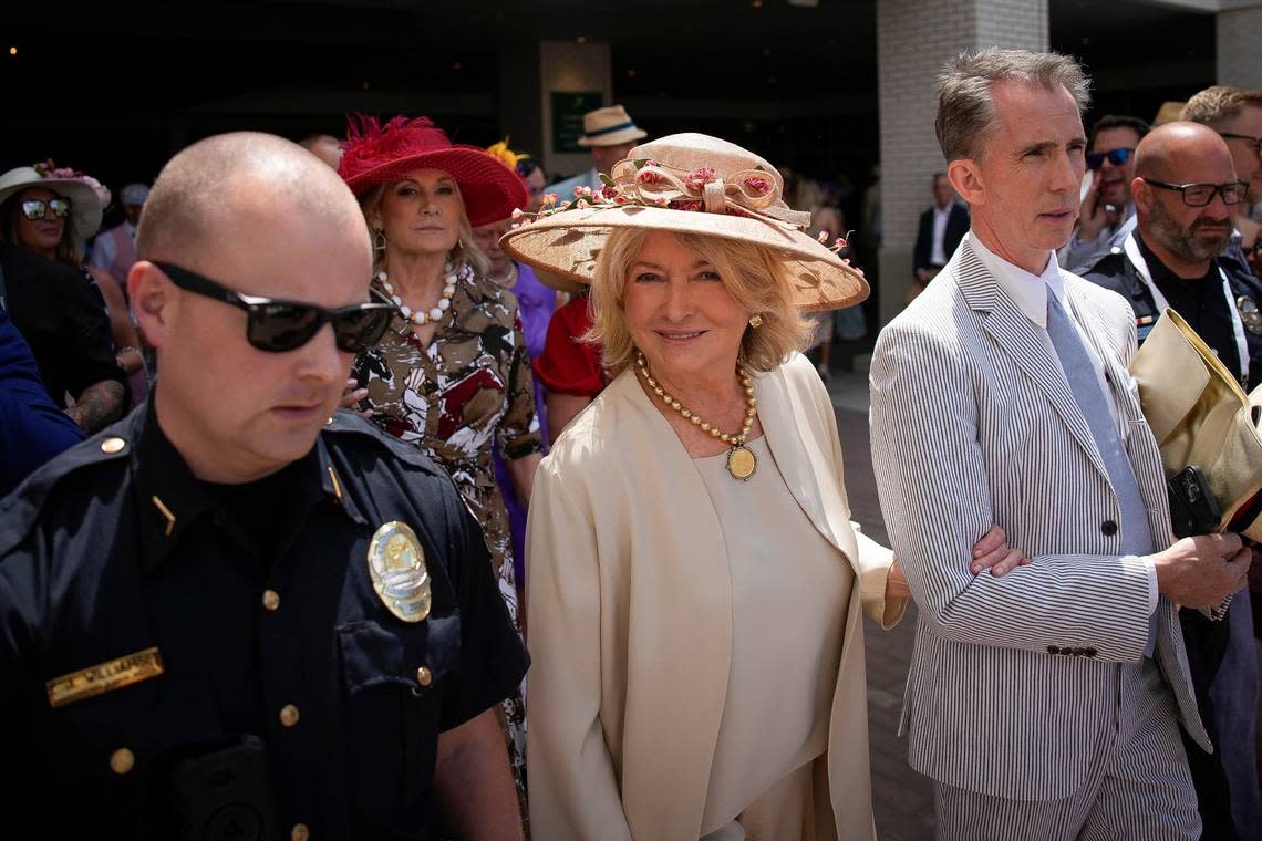 Martha Stewart is escorted through the crowds at Churchill Downs on the day of the 150th running of the Kentucky Derby, in Louisville, Kentucky, on May 4, 2024.