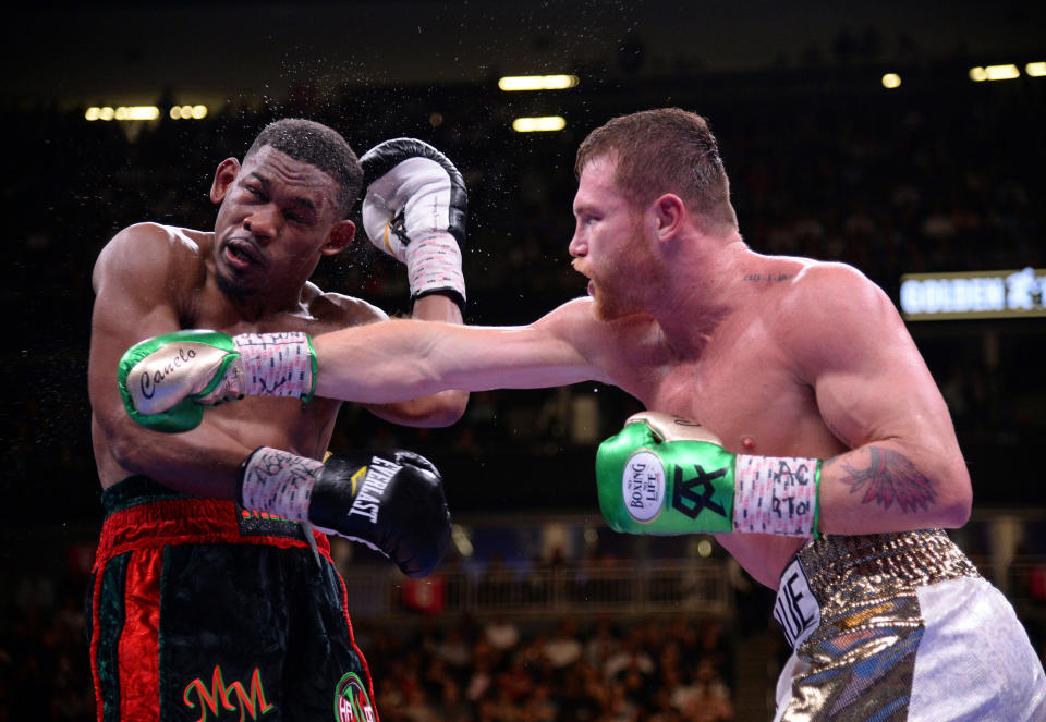 May 4, 2019; Las Vegas, NV, USA; Canelo Alvarez (white trunks) and Daniel Jacobs (black trunks) box during their WBC/WBA/IBF middleweight unification world championship boxing bout at T-Mobile Arena. Mandatory Credit: Joe Camporeale-USA TODAY Sports.  TPX IMAGES OF THE DAY