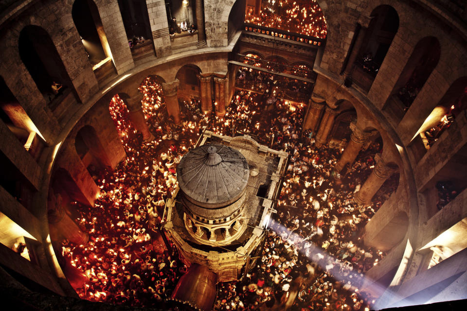 The Ceremony of the Holy Fire takes place every year on the Saturday before Easter in the Church of the Holy Sepulchre. Meant to symbolize the resurrection of Jesus, it is considered by many Orthodox Christians to be the longest-attested annual miracle in the Christian world.  This extraordinary image was shot from high up in the rotunda of the Church of Holy Sepulchre during the Ceremony of the Holy Fire. Thousands of candles are lit off a single flame that emerges from the Edicule. Within minutes the entire dome is filled with smoke.  (Image exclusive to The Huffington Post)