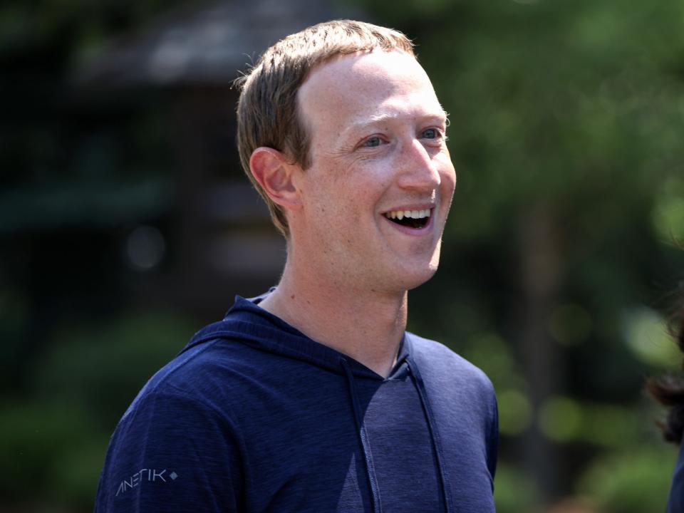 Mark Zuckerberg smiles while walking outside at 2021 Sun Valley conference