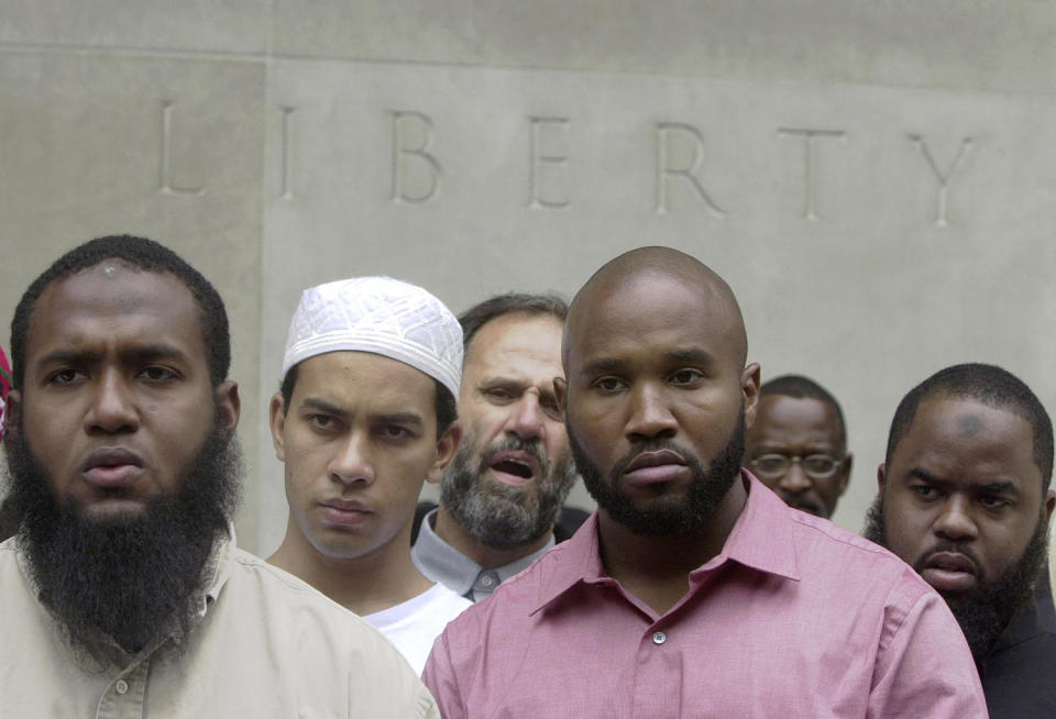 <p>Men listen to a speaker at a protest held by leaders of local mosques in front of the federal courthouse in Philadelphia, June 11, 2004. (Photo: Jacqueline Larma/AP) </p>