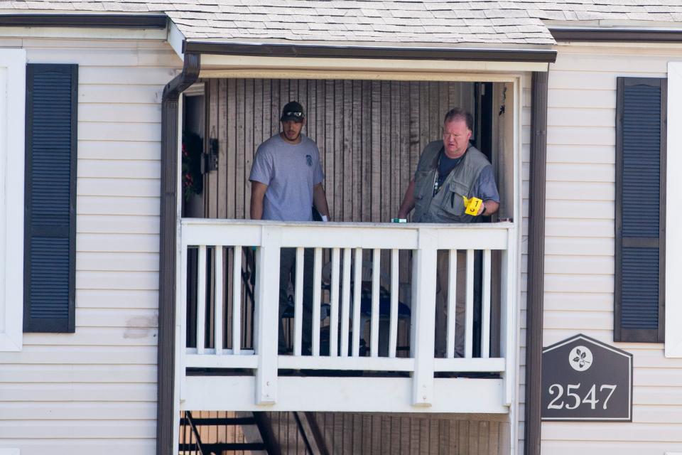 Tennessee Bureau of Investigation agents and Memphis Police Department officers investigate the scene of “a possible officer-involved shooting" after a man TBI identified as Eugene McNeal was found dead following a standoff with officers during a barricade situation in Raleigh on Sunday, August 20, 2023.