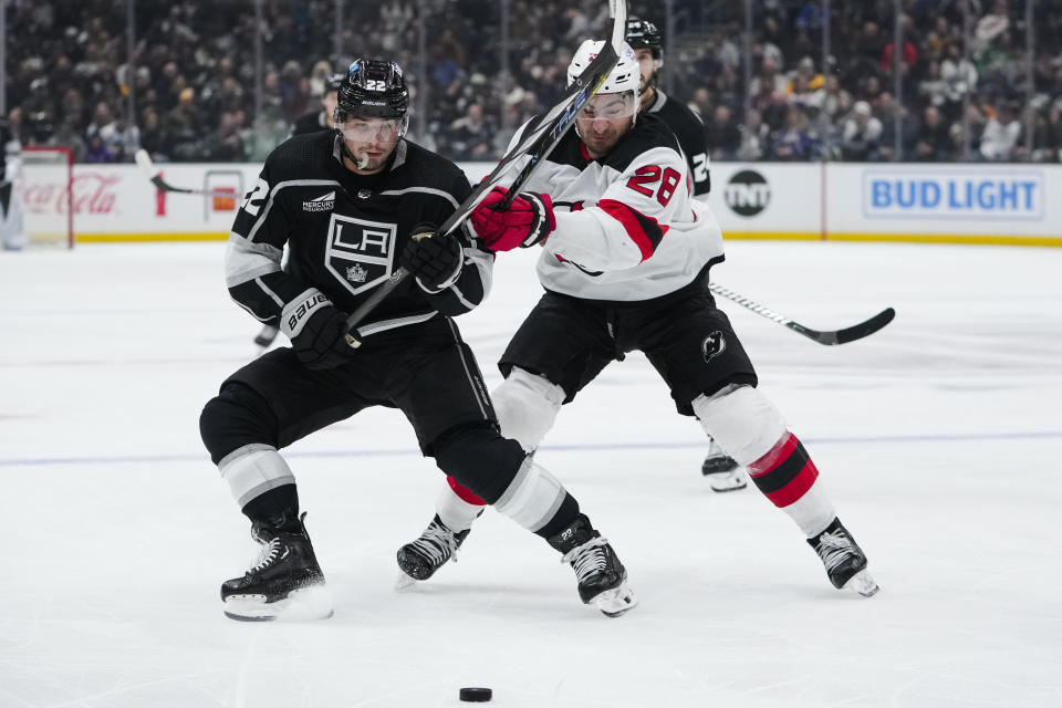 Los Angeles Kings left wing Kevin Fiala, left, and New Jersey Devils right wing Timo Meier vie for the puck during the second period of an NHL hockey game, Sunday, March 3, 2024, in Los Angeles. (AP Photo/Ryan Sun)