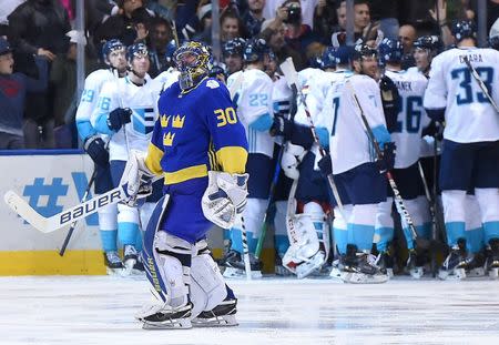 Sep 25, 2016; Toronto, Ontario, Canada; Team Sweden goalie Henrik Lundqvist (30) looks up at the video board as Team Europe players celebrate the winning goal in overtime during a semifinal game in the 2016 World Cup of Hockey at Air Canada Centre. Mandatory Credit: Dan Hamilton-USA TODAY Sports