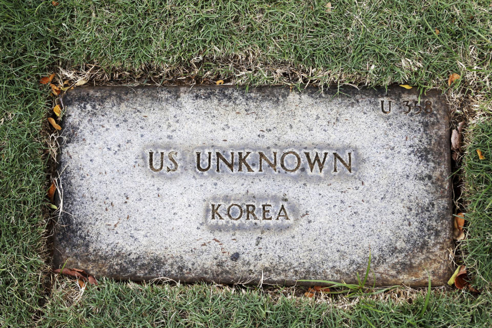 A grave marker for an unknown soldier from the Korean War is shown at the National Memorial Cemetery of the Pacific in Honolulu on Monday, July 30, 2018. Human remains handed over to the U.S. government from North Korea are expected to arrive Wednesday in Honolulu, where scientists will begin the painstaking process of trying to match DNA from the bones to those of American soldiers who didn't return from the Korean War more than a half century ago. (AP Photo/Caleb Jones)