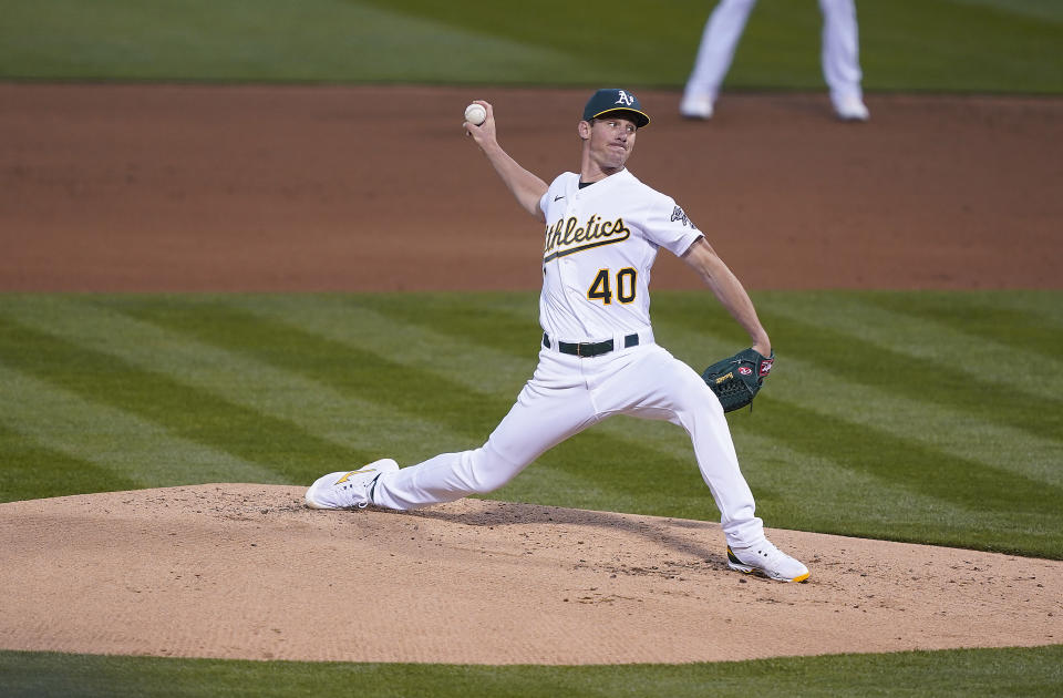 Oakland Athletics pitcher Chris Bassitt (40) throws against the Houston Astros in the second inning of an opening day baseball game Oakland, Calif., Thursday, April 1, 2021. (AP Photo/Tony Avelar)