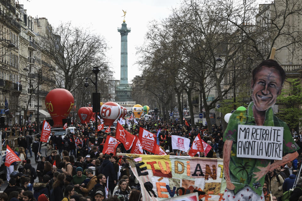 Protesters march during a rally in Paris, March 23, 2023, as labor unions hold their first mass demonstrations since President Emmanuel Macron enflamed public anger by forcing a higher retirement age through parliament without a vote. / Credit: Aurelien Morissard/AP