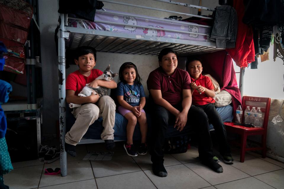 Some of Christina Ramirez family includes Jeffrey Sebastian,9, left, granddaughter Adalyn Perez, 3, James Sebastian, 12, and Fidencio Sebastian, 8, in their small apartment in West Palm Beach.