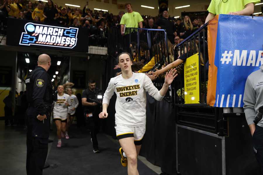 IOWA CITY, IOWA – MARCH 25: Caitlin Clark #22 of the Iowa Hawkeyes greets fans as she takes the court prior to tipoff against the West Virginia Mountaneers during the second round of the 2024 NCAA Women’s Basketball Tournament held at Carver-Hawkeye Arena on March 25, 2024 in Iowa City, Iowa. (Photo by Rebecca Gratz/NCAA Photos via Getty Images)