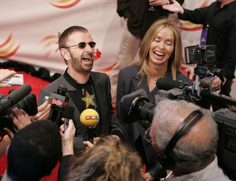 FILE - Ringo Starr, left, and his wife Barbara Bach laugh as they talk with the media on the red carpet at the premiere of "Love," a surrealistic portrayal of the Fab Four's career performed by Cirque du Soleil in Las Vegas, June 30, 2006. On Tuesday, April 9, 2024, it was announced that the final curtain will come down July 7 on Cirque du Soleil's long-running show “The Beatles Love," a cultural icon on the Las Vegas Strip that brought band members Paul McCartney and Starr back together for public appearances throughout its 18-year run. (John Locher/Las Vegas Review-Journal via AP, File)