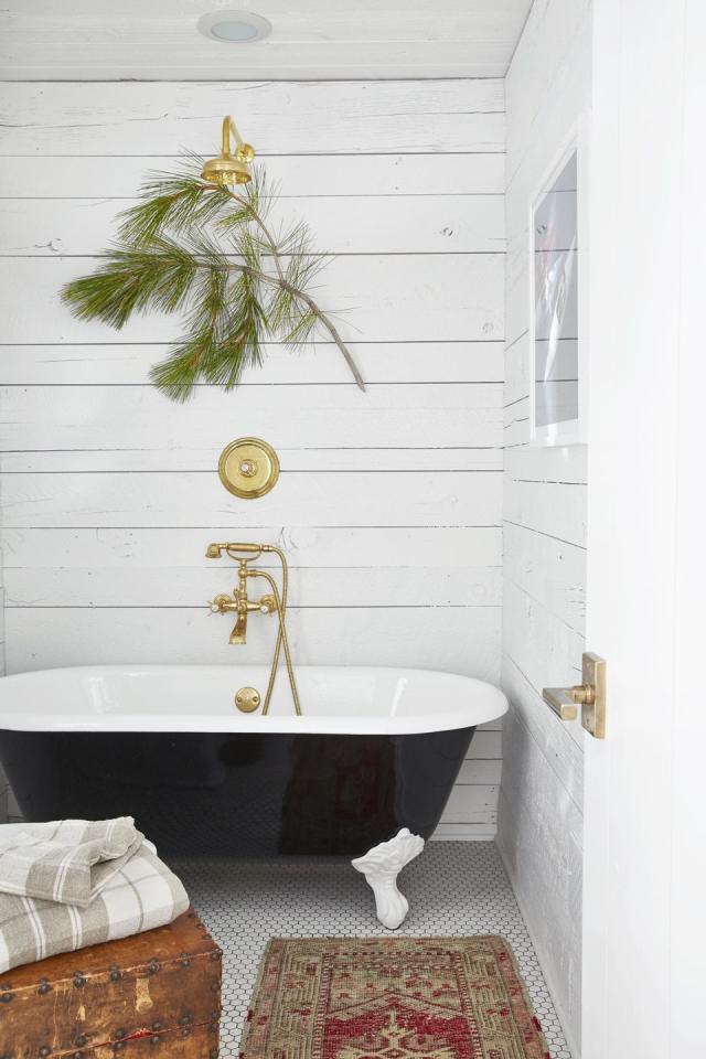 Bathroom Interior with Candles and a ClawFooted Tub · Creative Fabrica