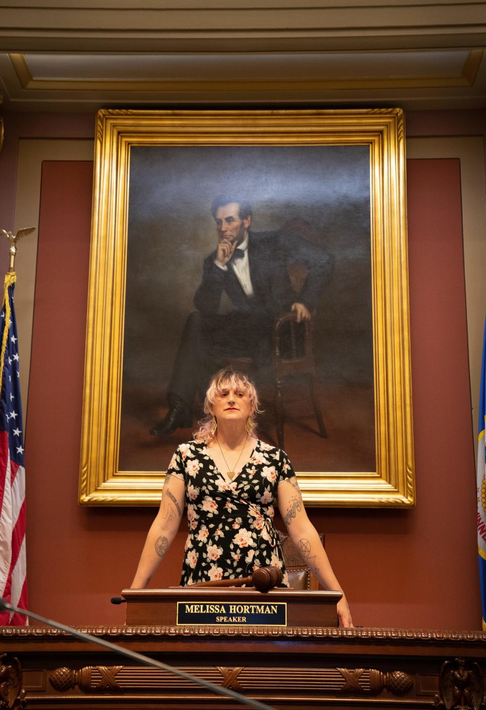 Minnesota House District 66A Rep. Leigh Finke (DFL) poses by the House speaker's seat.