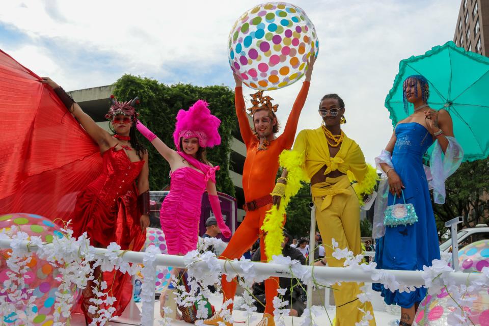 Members of the P&G float pose before the Cincinnati Pride Parade in Downtown Cincinnati, Saturday, June 25, 2022.