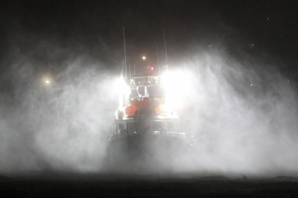 A fishing boat endures heavy rain and strong winds while moored at the port in Horta, in the Portuguese island of Faial, Wednesday, Oct. 2, 2019. Hurricane Lorenzo is lashing the mid-Atlantic Azores Islands with heavy rain, powerful winds and high waves. The Category 2 hurricane passed the Portuguese island chain Wednesday. (AP Photo/Joao Henriques)